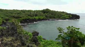Emily enjoys a day out in the caves, and black sand beach.